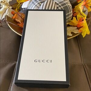 Authentic Gucci Classic Black & White box with dust bag
5.x9.5